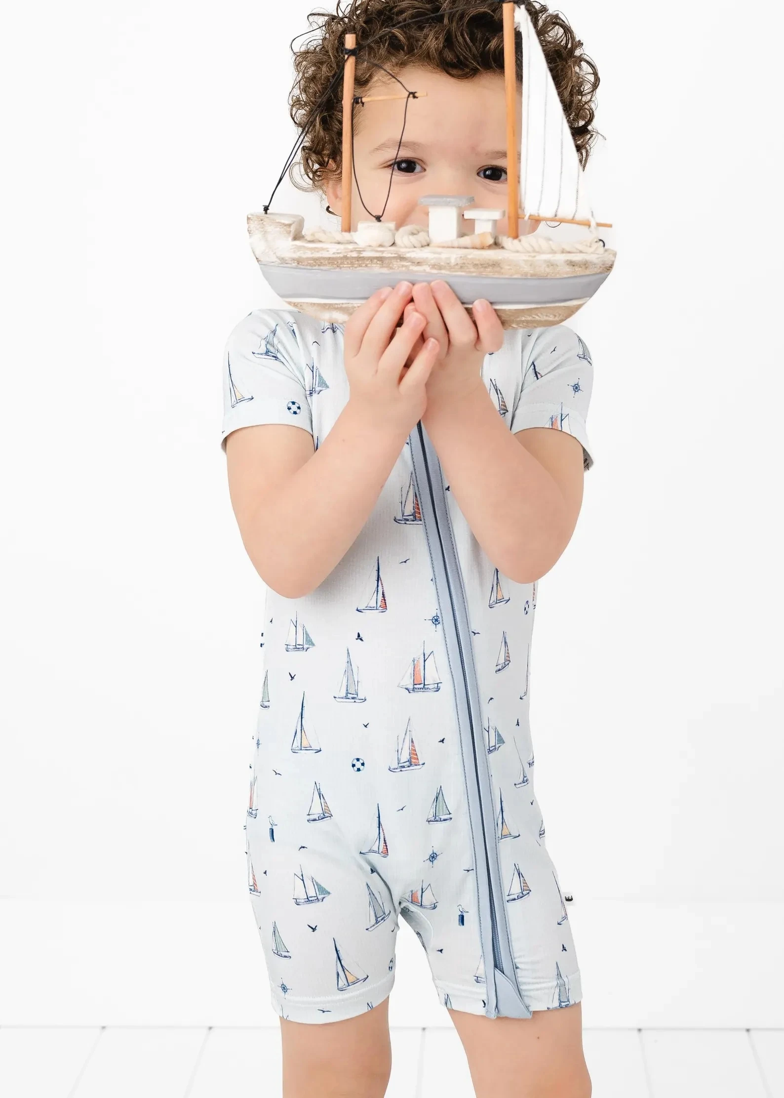 Soft bamboo romper in neutral tones, perfect for eco-conscious baby clothing retailers. Ideal for B2B wholesale orders and sustainable inventory.