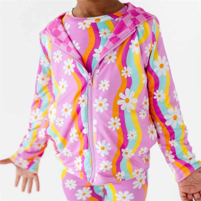 Adorable spring baby outfits in vibrant colors and soft fabrics, perfect for B2B wholesale buyers seeking trendy seasonal collections.
