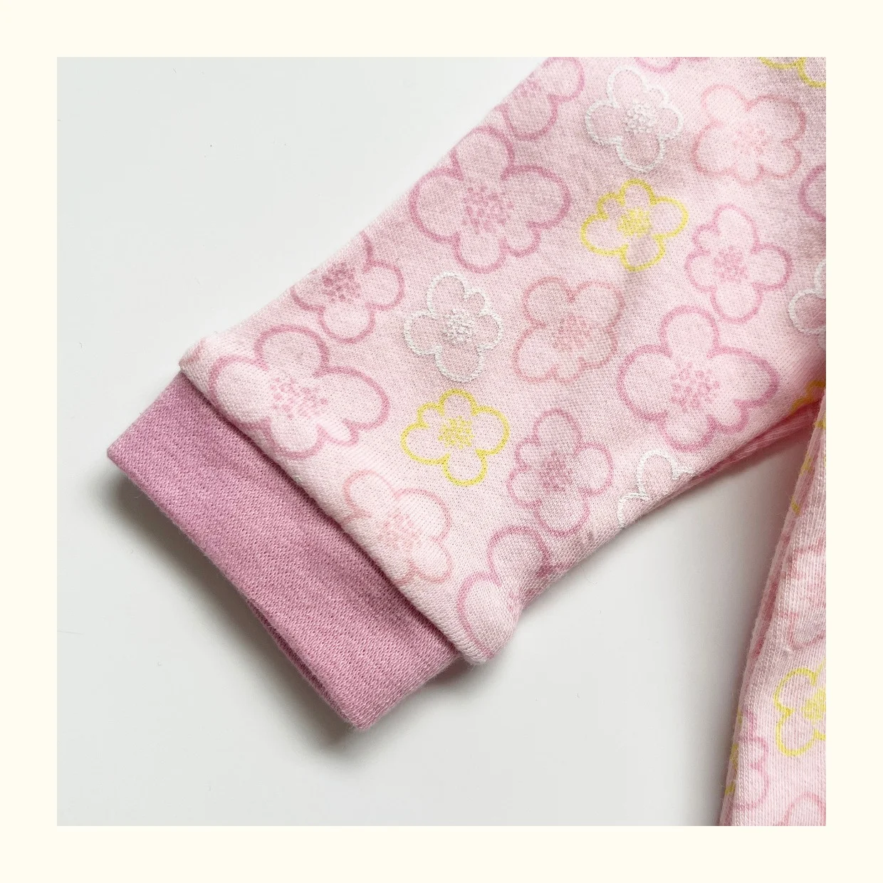 Adorable knitted baby clothing in soft pastel hues, perfect for B2B wholesale buyers seeking high-quality, handcrafted infant apparel.